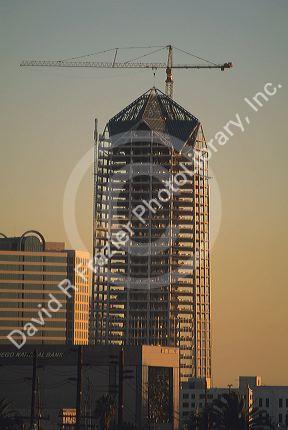New skyscraper construction with crane.