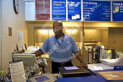 Postal worker at a post office in Boise, Idaho, USA. MR