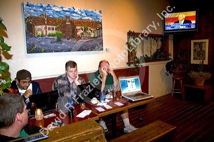 American people watch 2008 election coverage on television and computers in Boise, Idaho, USA.