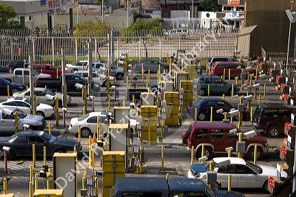 Automobiles being monitored by video cameras wait to enter the United States port of entry at the Tijuana, Baja California, Mexico/San Diego, California border crossing.