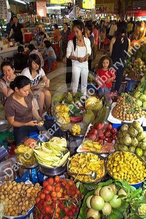 Vendors selling produce in the Ben Thanh Market located in Ho Chi Minh City, Vietnam.