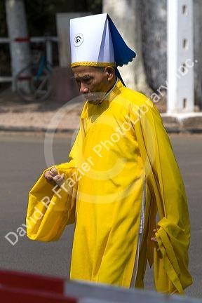 Caodaiist priest at the Tay Ninh Holy See in Tay Ninh, Vietnam.