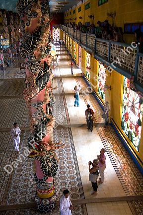 Tourists inside the Cao Dai Tay Ninh Holy See in Tay Ninh, Vietnam.