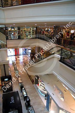 Escalators inside the Diamond Plaza shopping center in downtown Ho Chi Minh City, Vietnam.