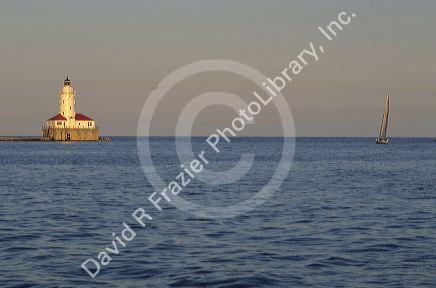 A lighthouse and sailboat on Lake Michigan, Chicago, Illinois.
