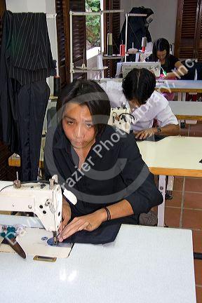 Workers sewing at the Yaly clothing factory in Hoi An, Vietnam.