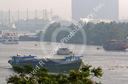 Activity on the Saigon River on a hazy, smoggy morning in Ho Chi Minh City, Vietnam.