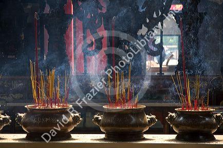 Incense burning at the Quan Am Pagoda, a famous Chinese temple in the Cholon district of Ho Chi Minh City, Vietnam.