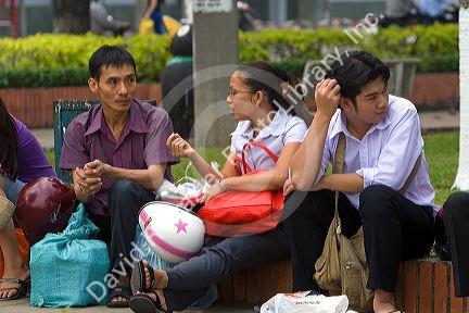 Vietnamese workers waiting for a ferry boat to cross the Saigon River in Ho Chi Minh City, Vietnam.