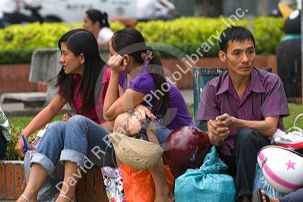 Vietnamese workers waiting for a ferry boat to cross the Saigon River in Ho Chi Minh City, Vietnam.