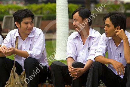 Vietnamese workers waiting for a ferry boat to cross the Saigon River in Ho Chi Minh City, Vietnam.