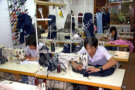 Workers sewing at the Yaly clothing factory in Hoi An, Vietnam.