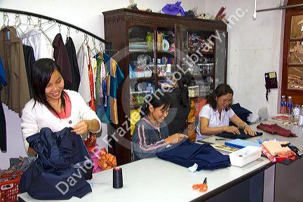 Workers sewing at the Yaly clothing factory in Hoi An, Vietnam.
