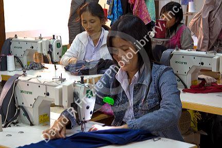 Workers sewing at the Yaly clothing factory in Hoi An, Vietnam.
