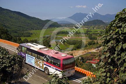 Bus traveling on road at Phu Gia, Vietnam.