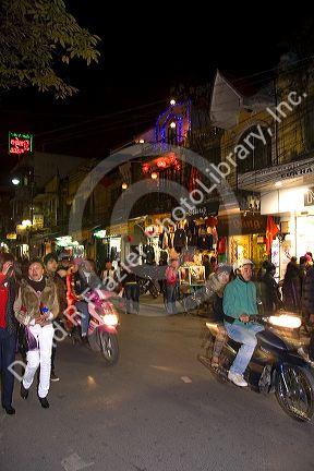 Night street scene during Tet in the historical center of Hanoi, Vietnam.