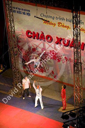 Acrobats entertain on a stage during the Tet festivities in Hanoi, Vietnam.