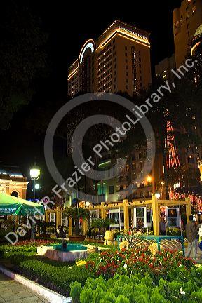 Caravelle Hotel and small landscaped park at night in Ho Chi Minh City, Vietnam.
