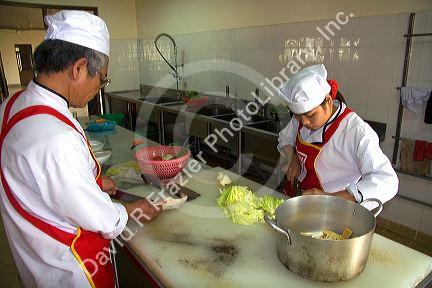 Chefs prepare food at a trade school in Dong Ha, Vietnam.