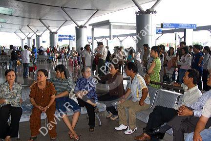 People waiting to greet passengers arriving at the Tan Son Nhat International Airport in Ho Chi Minh City, Vietnam.