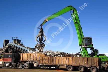 Electromagnetic crane lifting scrap steel for recycling at the Pacific Steel and Recycling center in Elmore County, Idaho.