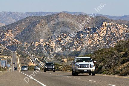 Automobiles traveling on Interstate 8 between El Centro and San Diego, Southern California, USA.