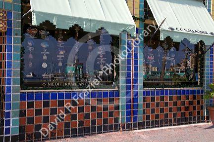 Reflection of harbor in Mediterranean Cafe windows in the town of Avalon on Catalina Island, California, USA.