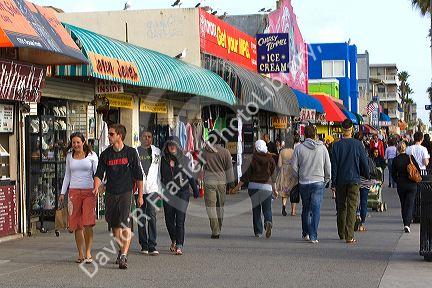 People and boardwalk retail space at Venice Beach, Los Angeles, California.