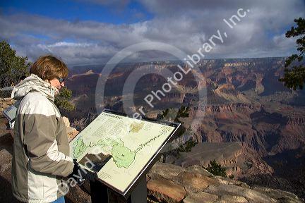 Tourist views the South Rim of the Grand Canyon, Arizona, USA. MR