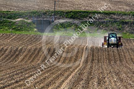 Farmer planting potato crop in Canyon County, Idaho, USA.