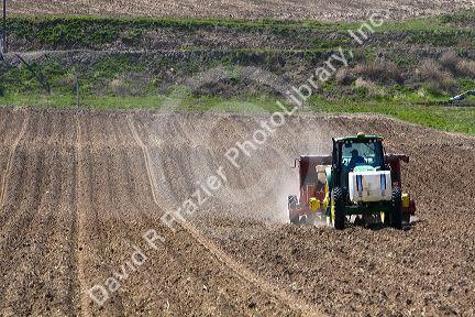 Farmer planting potato crop in Canyon County, Idaho, USA.