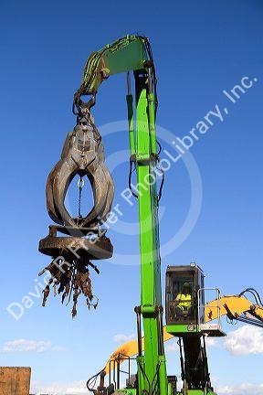 Electromagnetic crane lifting scrap steel for recycling at the Pacific Steel and Recycling center in Elmore County, Idaho.