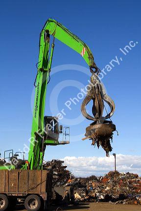 Electromagnetic crane lifting scrap steel for recycling at the Pacific Steel and Recycling center in Elmore County, Idaho.
