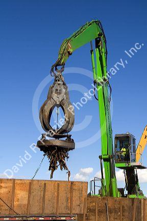Electromagnetic crane lifting scrap steel for recycling at the Pacific Steel and Recycling center in Elmore County, Idaho.