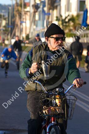 Bicyclist at Mission Beach in San Diego, Southern California, USA.