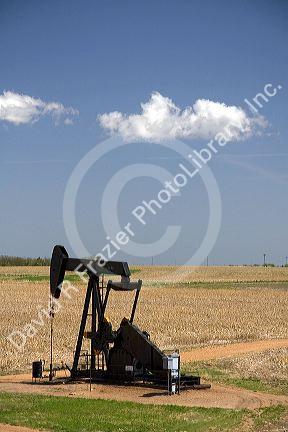 Oil well pumpjack in Russell County, Kansas, USA.