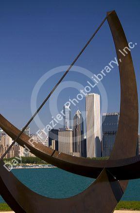 Cast bronze sundial sculpture named Man Enters the Cosmos by artist Henry Moore located on Lake Michigan outside the Adler Planetarium in Chicago, Illinois, USA.