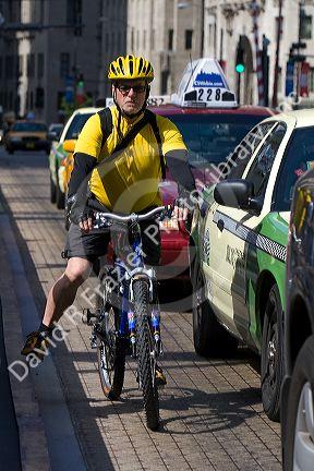 Bicyclist in downtown Chicago, Illinois, USA.