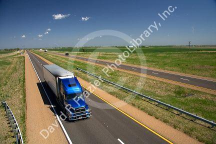 Long haul truck traveling on Interstate 70 in Russell County, Kansas, USA.