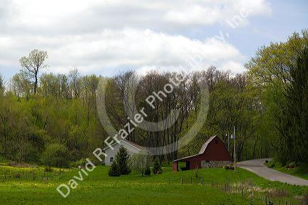 Red barn and country road in Sauk County, Wisconsin, USA.
