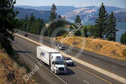 Truck transporting freight through the Columbia River Gorge near Hood River, Oregon, USA.