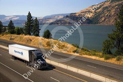 Truck transporting freight through the Columbia River Gorge near Hood River, Oregon, USA.