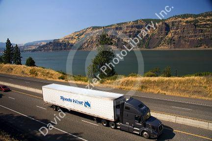 Truck transporting freight through the Columbia River Gorge near Hood River, Oregon, USA.
