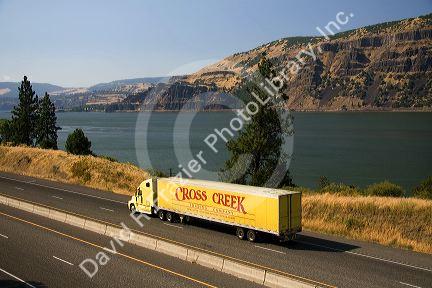 Truck transporting freight through the Columbia River Gorge near Hood River, Oregon, USA.