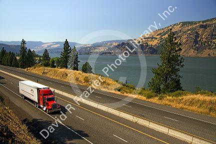 Truck transporting freight through the Columbia River Gorge near Hood River, Oregon, USA.