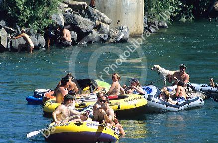 People float down the Boise River on inner tubes and rafts in Boise, Idaho.