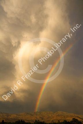 Rainbow over the foothills and city of Boise, Idaho, USA.