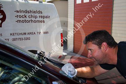 Chipped car windshield being repaired in Boise, Idaho, USA.