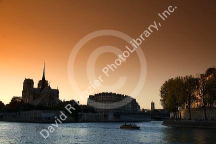 Nortre Dame cathedral and the River Seine at sunset in Paris, France.