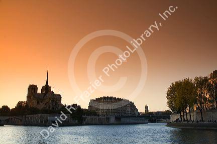 Nortre Dame cathedral and the River Seine at sunset in Paris, France.